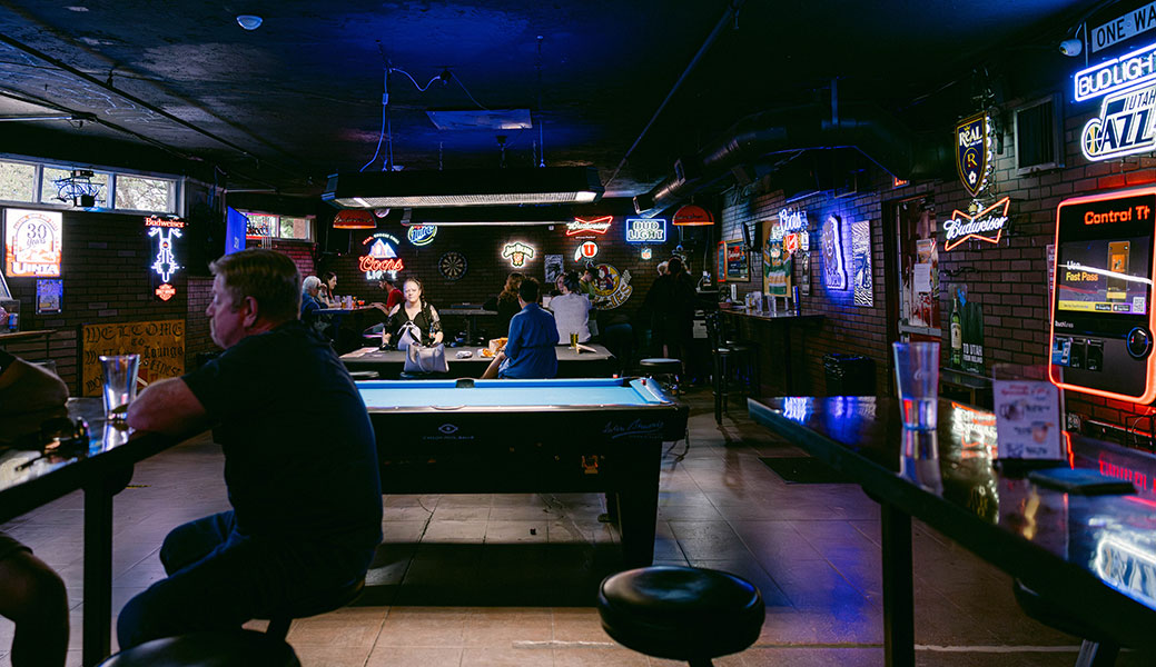 friend enjoying drinks and pool at Willie's Lounge best dive bar in Salt Lake City